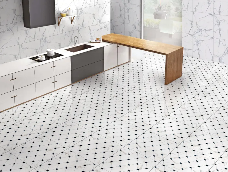 Elegant white kitchen design with black and white patterned flooring and a wooden integrated dining table.